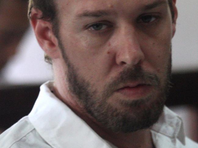 Australian Joshua Baker sits next to his sister before his drugs trial at Denpasar District Court in Bali. Joshua's lawyer hopes the Judge will send him to mental hospital for mental treatment. Pic: Lukman S Bintoro