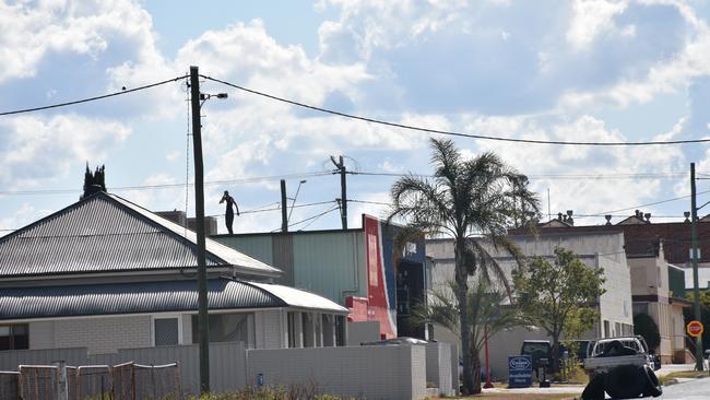 ON SCENE: The Warwick man during yesterday’s rooftop siege. Picture: Jessica Paul