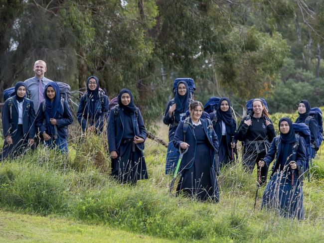 Sirius College students with teachers Nicole Ware and Scott Westray. The group of girls completed the Kokoda Track. Picture: Andy Brownbill