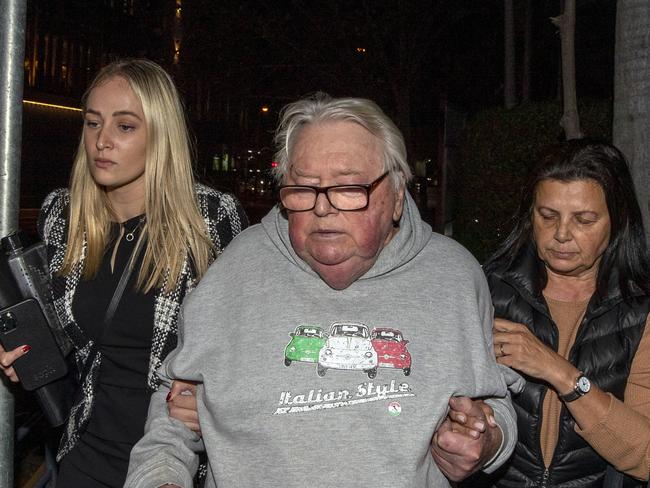 Former swim coach Dick Caine, flanked by his lawyer Sophie Newham and wife Jenny, is now facing 40 child sex charges after police laid additional charges against him last week. Picture: Liam Mendes / The Australian