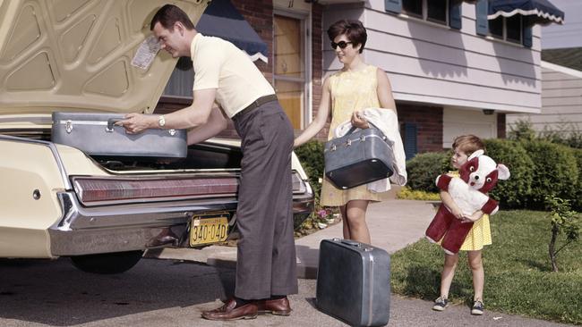 Getting ready to hit the road. with matching luggage and teddy bear. Picture: Getty Images