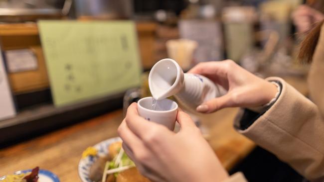 Pour sake for senior members of the group first. Picture: iStock