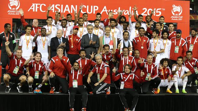 UAE team celebrates with their bronze medals.