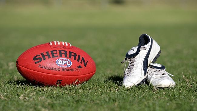 Generic AFL Sherrin football and football boots. sport /