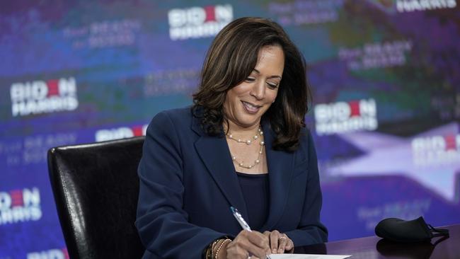 Kamala Harris signs paperwork officially accepting the Democratic nomination for Vice President. Picture: Drew Angerer/Getty Images