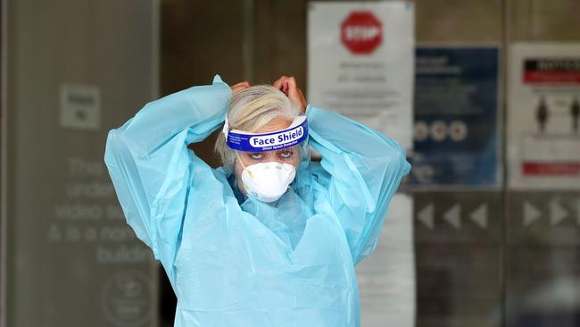 It comes amid a number of new cases in Victoria. Pictured is a member of COVID testing team arriving at a Victorian aged care facility. Picture: David Crosling