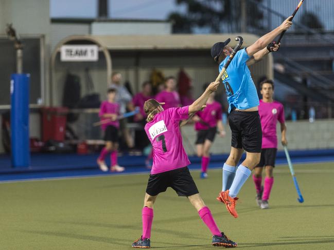 Liam Pember (left) of AgEtal Farmers and Ashley Ziviani of SQPS Scorers in Club Glenvale Challenge round two men's hockey at Clyde Park, Friday, February 19, 2021. Picture: Kevin Farmer