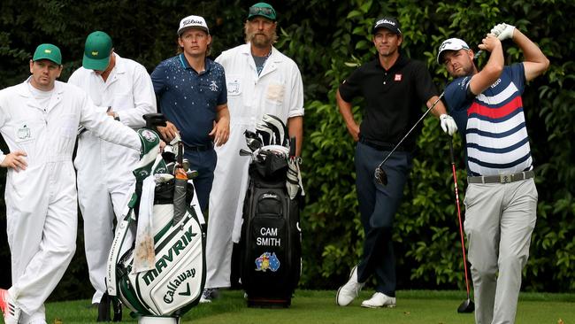 Aussie Marc Leishman tees off at Augusta last year as Adam Scott and Cameron Smith look on. Picture: Rob Carr/Getty Images/AFP