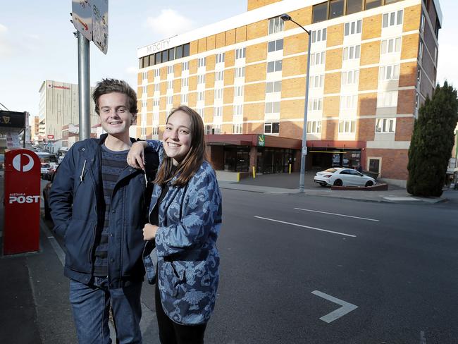 UTAS students Monte Bovill and Chelsea Wilde outside the university’s new acquisition, the MidCity Hotel. Picture: RICHARD JUPE