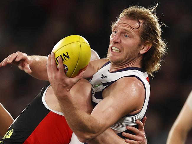 MELBOURNE.  09/07/2022 . AFL . Round 17.    St Kilda vs Fremantle at Marvel Stadium .  David Mundy of the Dockers tries to clear as he is tackled by Zac Jones of the Saints    . Photo by Michael Klein