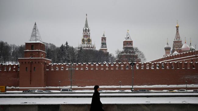 A woman walks in front of the Kremlin in Moscow. Picture: AFP.