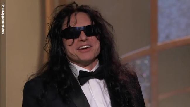 Tommy Wiseau tries to grab the mic from James Franco in acceptance speech