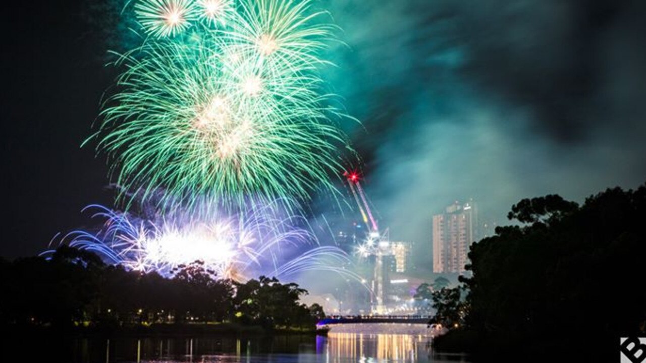 The midnight fireworks display at Adelaide's Elder Park light up the Torrens. Picture: David Brand