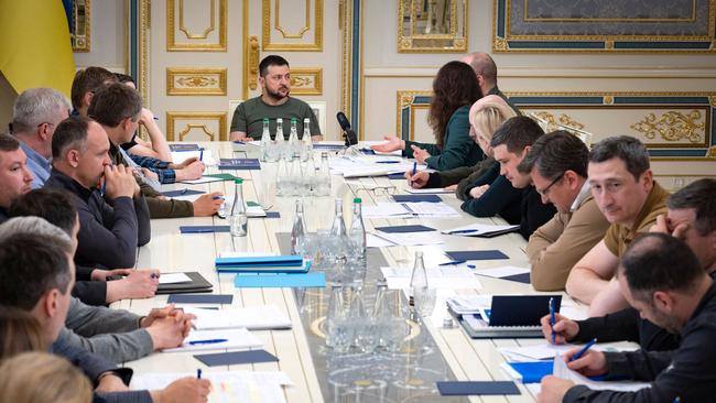 Ukrainian President Volodymyr Zelensky meets with local leaders. Picture: AFP