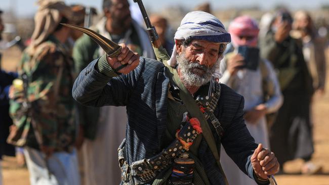 A Yemeni tribal gunman takes part in a demonstration denouncing Israeli strikes and in solidarity with Palestine, in the suburbs of the Huthi-controlled capital Sanaa, on December 23, 2024. (Photo by Mohammed HUWAIS / AFP)