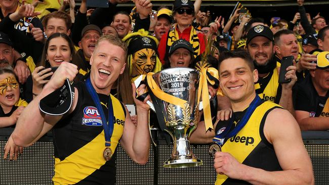 The tough midfielder enjoys last year’s Grand Final win with Josh Caddy.