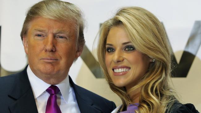 Happier times. Donald Trump poses with Miss California USA Carrie Prejean.