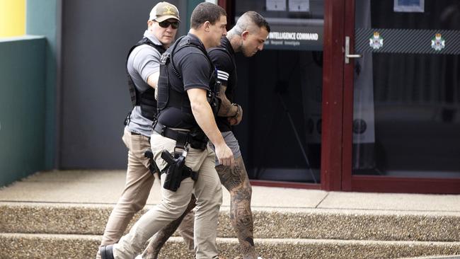 Harley Barbaro being escorted by police to the Southport Watchhouse.