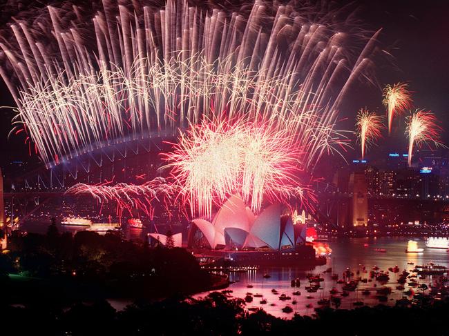 3, 2, 1, Happy New Millennium! Sydney Opera House &amp; Harbour Bridge light up with their iconic fireworks to welcome in the new era. Picture: Nick Cubbin