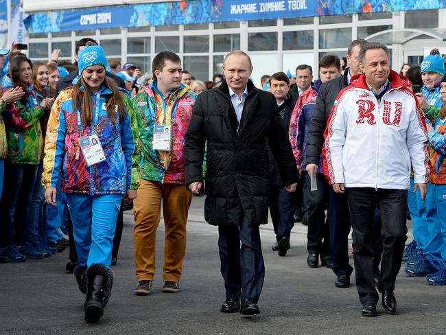 In this Feb. 5, 2014 file photo Russian President Vladimir Putin, centre, visits the Olympic Athletes Village in Coastal Cluster ahead of the Sochi 2014 Winter Olympics.