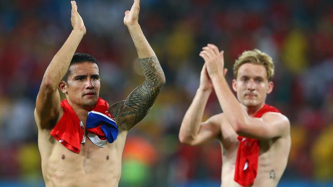 Tim Cahill and Ben Halloran of Australia acknowledge the fans after being defeated by Chile 3-1.