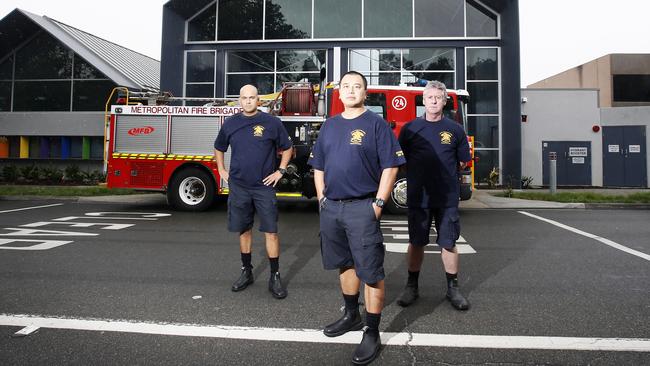 Firefighters Dominic Britt, Afonso Lai and Frank Howell outside the station to be razed. Picture: Paul Loughnan