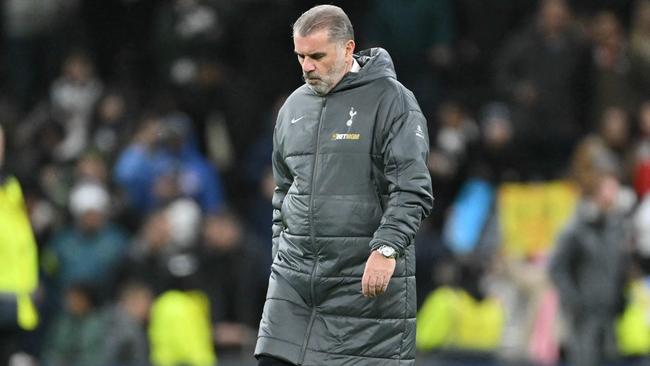 Tottenham Hotspur's Greek-Australian Head Coach Ange Postecoglou reacts to their defeat as he leaves after the English Premier League football match between Tottenham Hotspur and Liverpool at the Tottenham Hotspur Stadium in London, on December 22, 2024. Liverpool won the game 6-3. (Photo by Glyn KIRK / AFP) / RESTRICTED TO EDITORIAL USE. No use with unauthorized audio, video, data, fixture lists, club/league logos or 'live' services. Online in-match use limited to 120 images. An additional 40 images may be used in extra time. No video emulation. Social media in-match use limited to 120 images. An additional 40 images may be used in extra time. No use in betting publications, games or single club/league/player publications. /