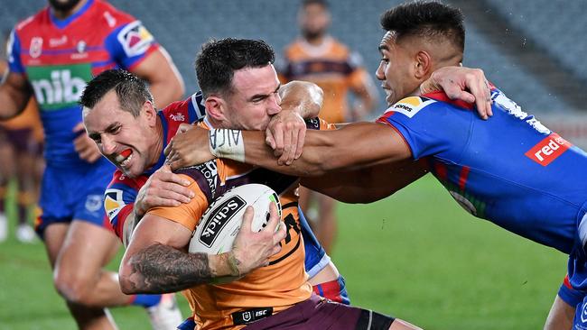 Darius Boyd is tackled by Mitchell Pearce (left) and Hymel Hunt in Brisbane’s loss to Newcastle last month. Picture: AAP Image