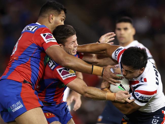 Fetalaiga Pauga of the Roosters is tackled. (Photo by Cameron Spencer/Getty Images)