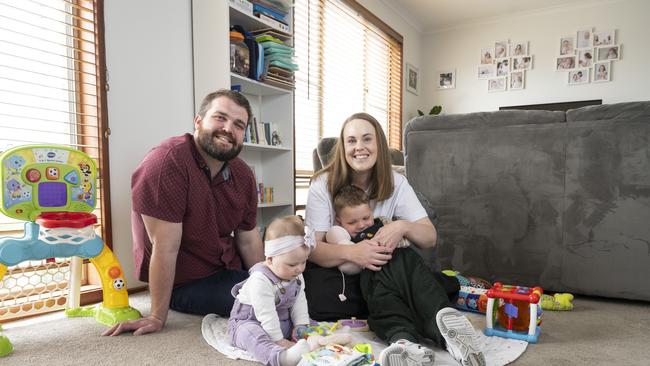 Monique (a primary school teacher) and Hayden Robinson (a nurse) with their kids Henry and Rosie, are keen to return to Sydney from Canberra. Picture: Martin Ollman