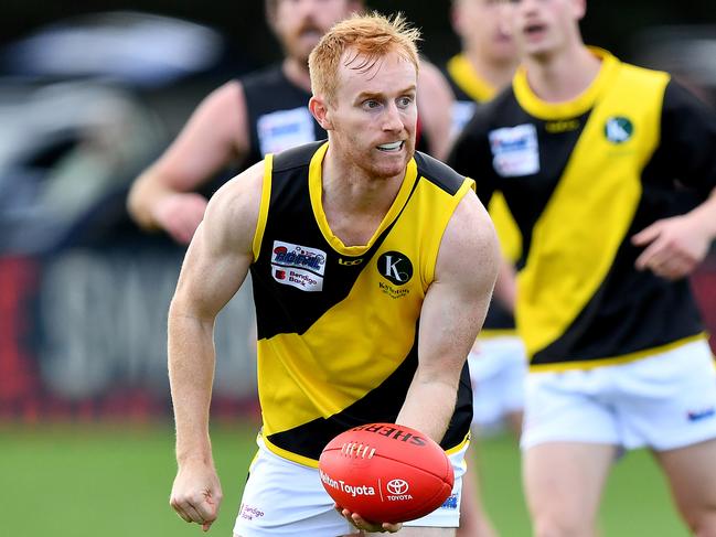 James Gaff of Kyneton handballs during the round two RDFNL Bendigo Bank Seniors match between Riddell and Kyneton at Riddells Creek Recreation Reserve, on April 13,2024, in Diggers Rest, Australia. (Photo by Josh Chadwick)