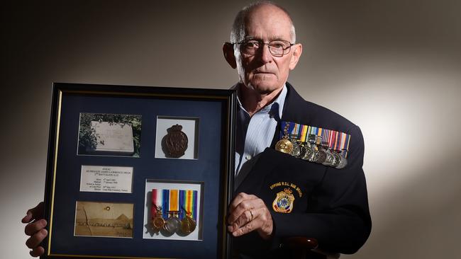 Royal Australian Navy veteran Brian Swan holds his grandfather’s WW1 medals at his Epping home today. Photo: Troy Snook