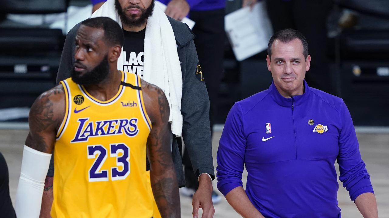 LAKE BUENA VISTA, FLORIDA - AUGUST 18: Head coach Frank Vogel and LeBron James #23 of the Los Angeles Lakers walk on the court during a timeout due to a goal being knocked out of position during action against the Portland Trail Blazers in the first half in Game 1 of Round 1 of the NBA Playoffs at AdventHealth Arena at ESPN Wide World Of Sports Complex on August 18, 2020 in Lake Buena Vista, Florida. NOTE TO USER: User expressly acknowledges and agrees that, by downloading and or using this photograph, User is consenting to the terms and conditions of the Getty Images License Agreement. (Photo by Ashley Landis-Pool/Getty Images)