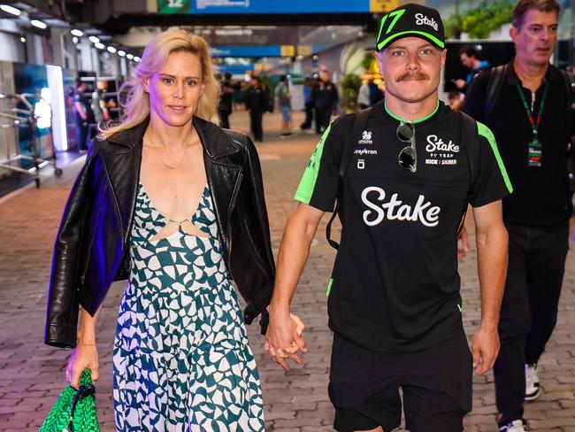 Bottas with girlfriend Tiffany Cromwell arriving in the F1 paddock ahead of qualifying for the recent F1 Grand Prix. Picture: Kym Illman/Getty Images