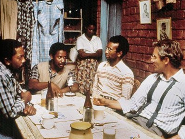 Denzel Washington as Biko (second left) and Kevin Kline as Donald Woods (right) in a scene from the 1987 film Cry Freedom.