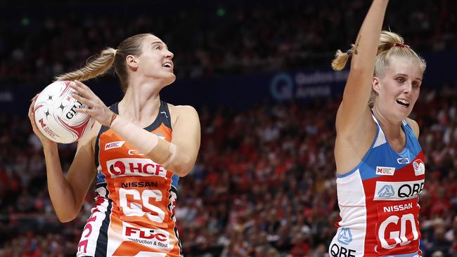 Caitlin Bassett, left, in action for the Giants against NSW Swifts in the opening round of the Super Netball competition on Sunday. Picture: Getty Images