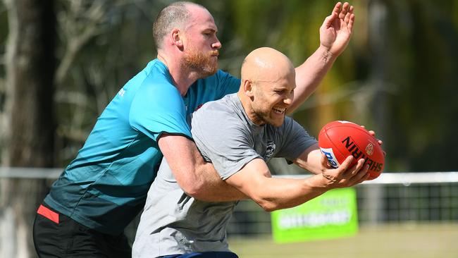 Gary Ablett and Jarryd Roughead fought it out in an entertaining training session inside the Gold Coast mini hub. Picture: Getty Images