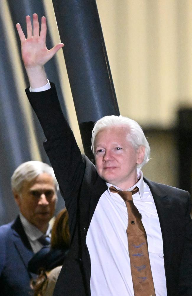 WikiLeaks founder Julian Assange waves after arriving at Canberra Airport. Picture: AFP