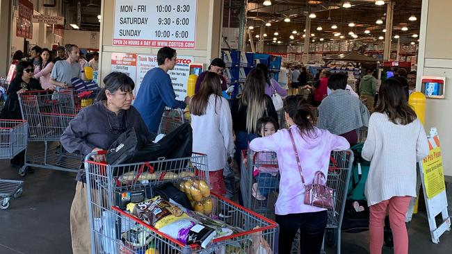 Chinese shoppers are stockpiling consumer basics like toilet paper and water. Picture: AFP