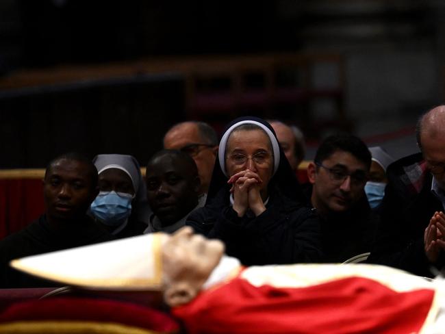 Thousands of Catholics began paying their respects to former pope Benedict XVI at St Peter's Basilica at the Vatican, at the start of three days of lying-in-state before his funeral. Picture: AFP