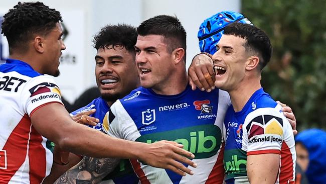 TAMWORTH, AUSTRALIA - MAY 11: Bradman Best of the Knights celebrates a try with team mates during the round 10 NRL match between Wests Tigers and Newcastle Knights at Scully Park, on May 11, 2024, in Tamworth, Australia. (Photo by Mark Evans/Getty Images)