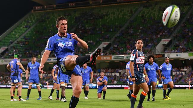 Dane Haylett-Petty of the Force kicks the ball into touch.