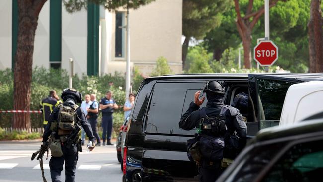 Law enforcement officers stand in front of a synagogue, following the fire and explosion of cars in La Grande-Motte, south of France. Picture: AFP