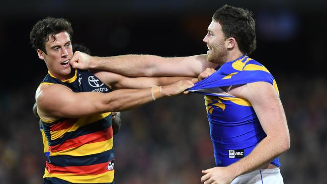 Kyle Hartigan squares off with Eagles forward Jeremy McGovern. Picture: AAP Image/Mark Brake