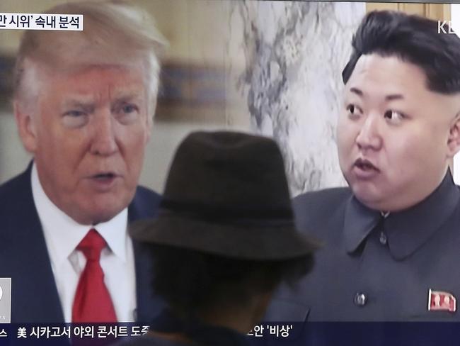 A man in Seoul watches two leaders that might have the fate of his country in their hands. Picture: AP/Ahn Young-joon