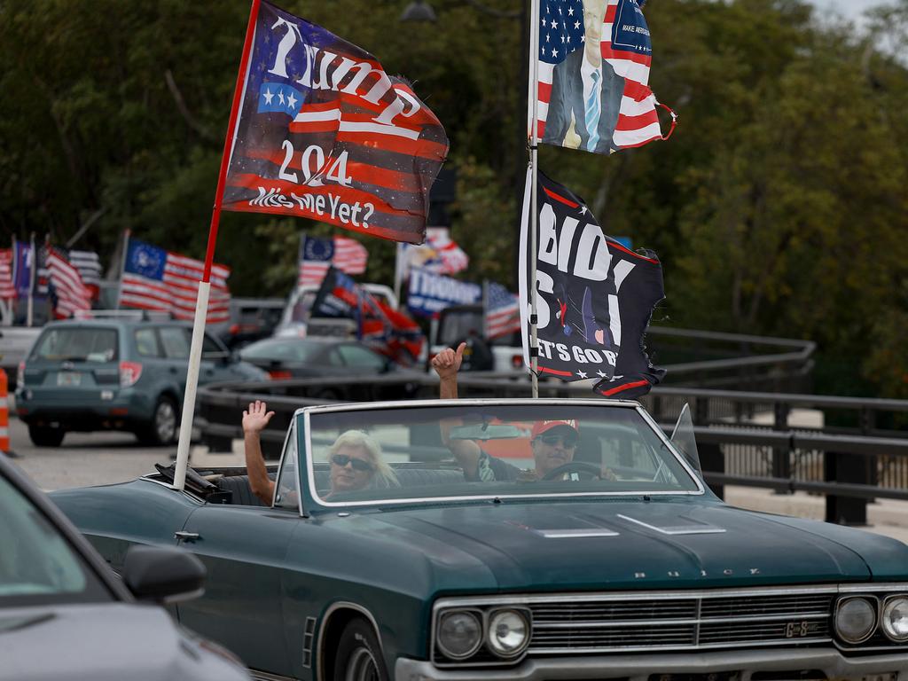 Supporters of Donald Trump drive near his Mar-a-Lago home in Palm Beach, Florida. Picture: AFP