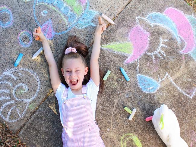 Annaliah has been chalk drawing in her driveway to help lift peoples spirits but one council has labelled the childhood pastime “vandalism”.