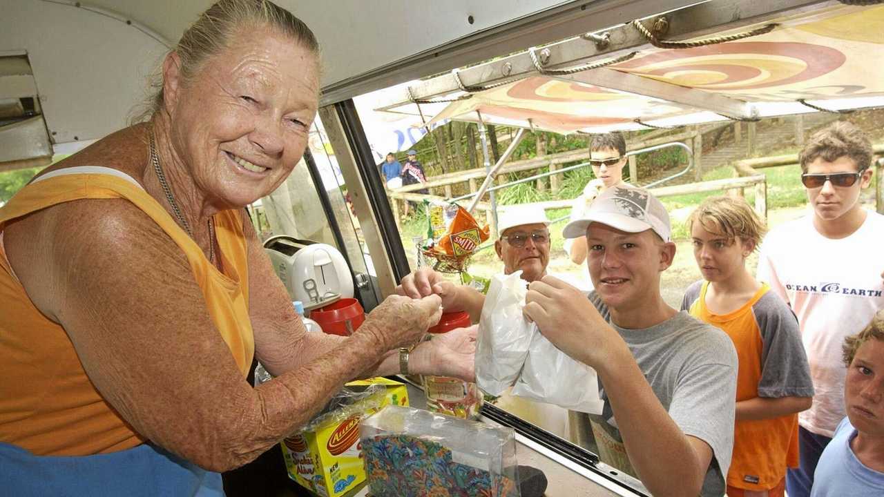 Betty Wallace serves Campbell Marr at Betty's Beach Burgers, Noosa in 2003. Picture: Warren Lynam