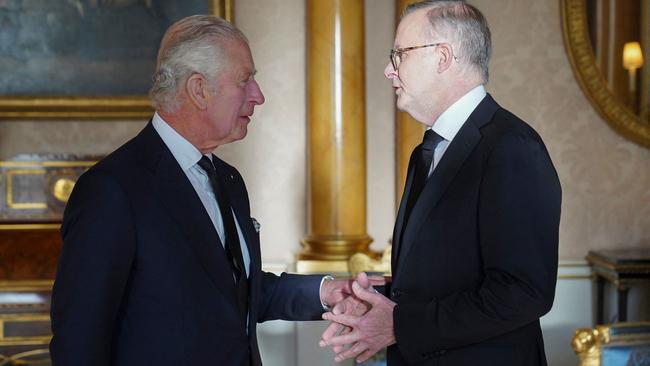 King Charles III (L) speaks with Anthony Albanese as he receives realm prime ministers in the 1844 Room at Buckingham Palace in London.