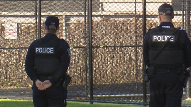 Police on patrol around the perimeter of Glenelg Primary School during Thursday morning drop-off. Picture: 7NEWS